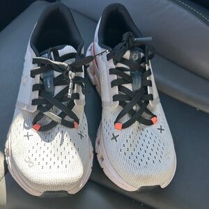 On Running Sneakers in Light Gray with Black and Orange